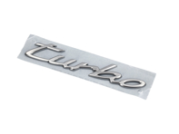 Stemma 'Turbo' sul cofano posteriore, argento chiaro metallizzato. PorscheTaycan - 9J1853675COU2, 9J1853675C Stemma 'Turbo' sul cofano posteriore, argento chiaro metallizzato. PorscheTaycan - 9J1853675COU2, 9J1853675C