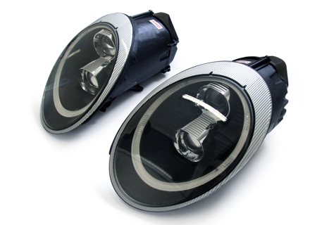 Hoofdlamp Dual Projector Xenon + Aurora light, zwarte lens. Porsche 997 05-08 rechts gestuurd - 99763115713, 99763115813 Hoofdlamp Dual Projector Xenon + Aurora light, zwarte lens. Porsche 997 05-08 rechts gestuurd - 99763115713, 99763115813